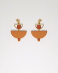 A pair of stud dangle earrings sit against a white background. They feature a small half circle brass piece with a wooden circle bead enclosed, below this hangs a mustard D shape bead followed by a small wooden bead and a tiny gold bead.