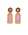 A pair of stud dangle earrings lay against a white background. They feature a wooden flower stud top followed by a purple acrylic arch with a silver thread detail. On top sits an enamel wavy arch frame in orange.